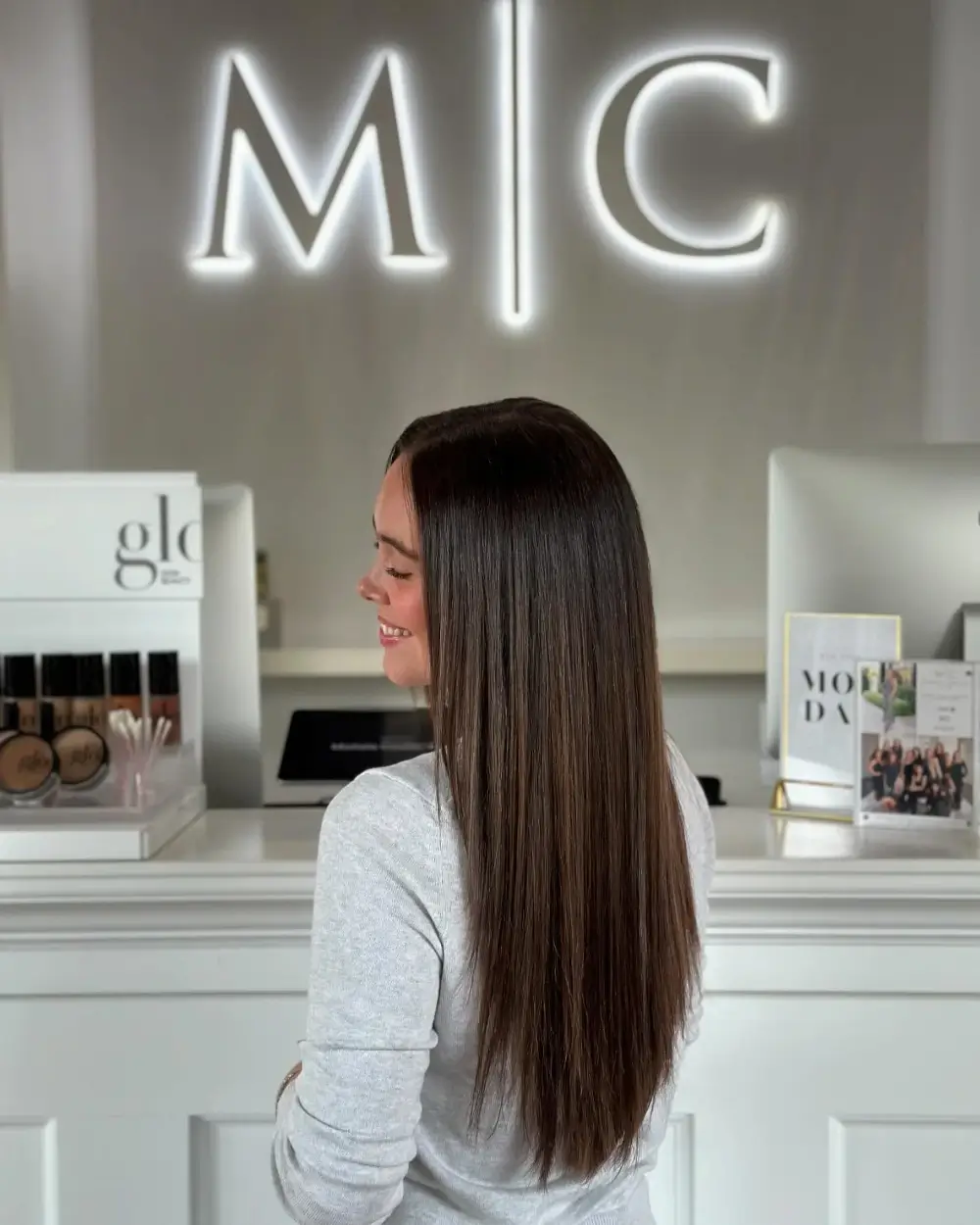Chocolate brown Bellami hair extensions blended for added length and fullness at Michele Coulter Salon in Milton GA