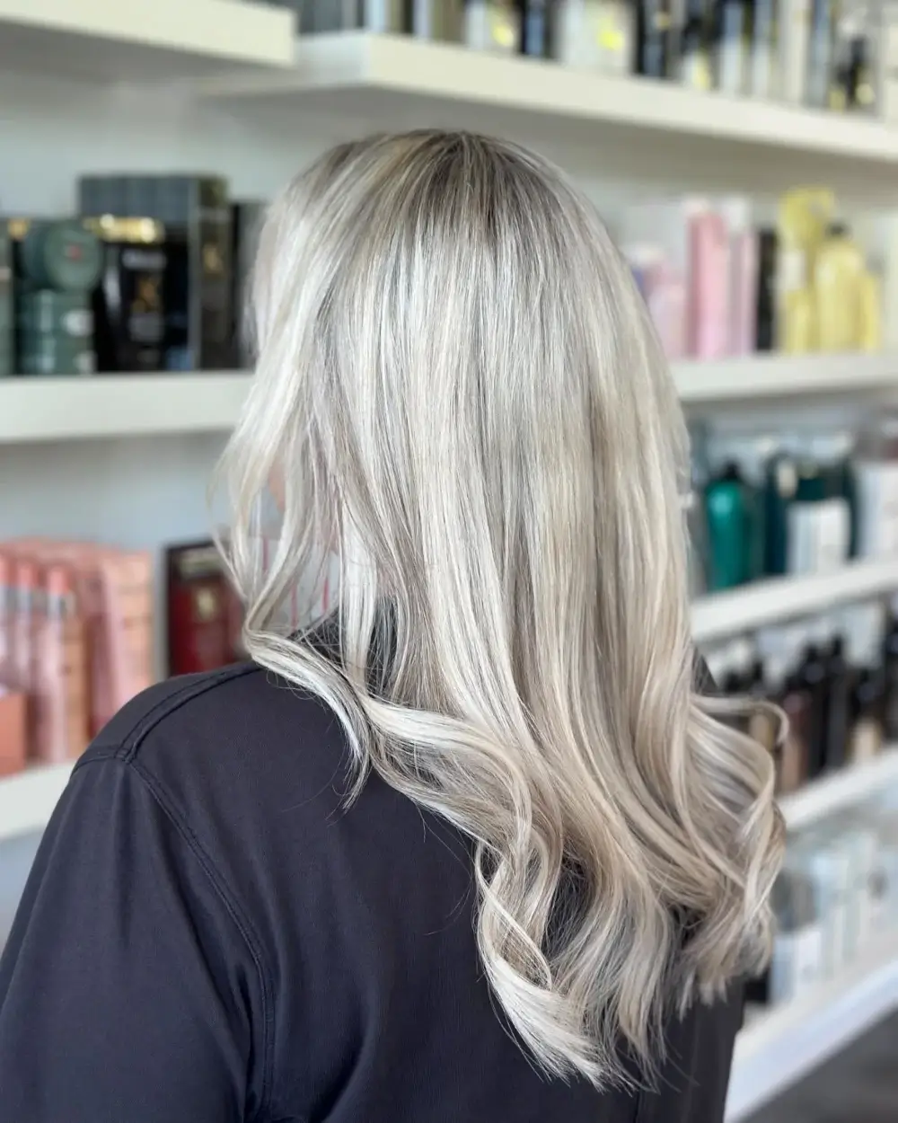 Blonde hair extensions with highlights at Michele Coulter Salon in Milton GA