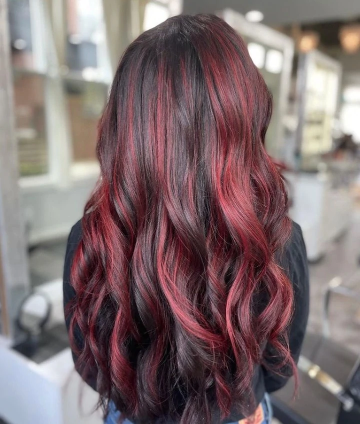 Dimensional red highlights and custom hair color at Michele Coulter Salon in Milton GA