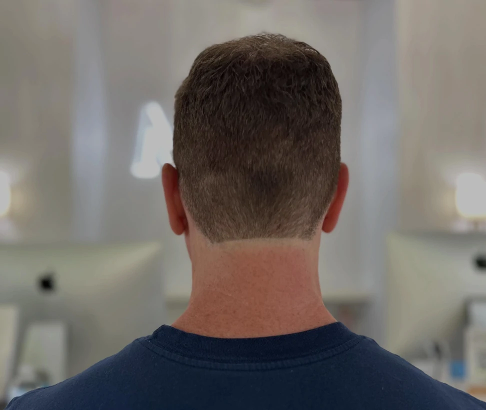 Back view of a men's short haircut at Michele Coulter Salon in Milton GA